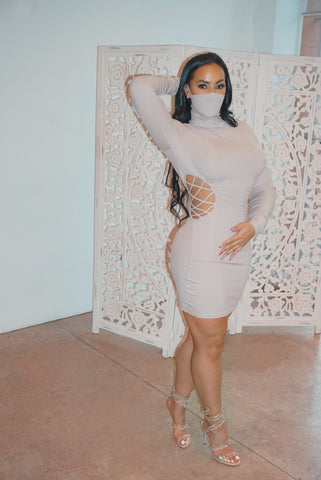A little tease body con dress with attached mask turtle neck